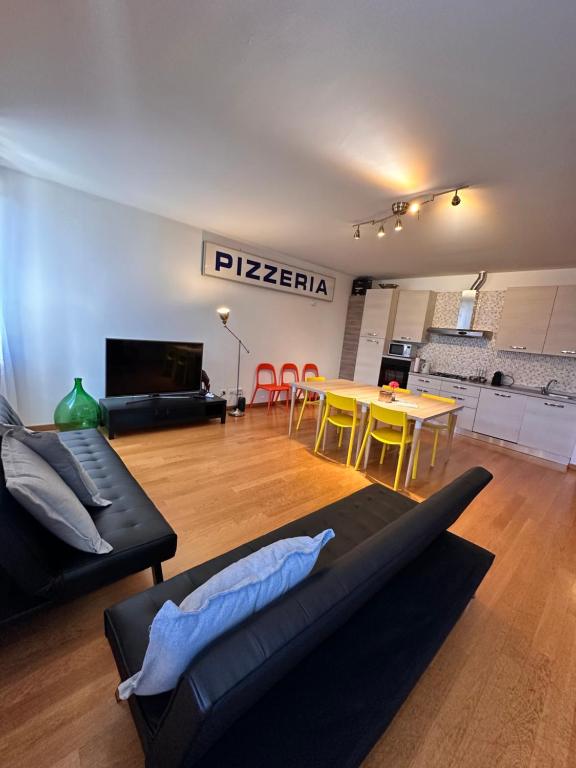 a living room with a couch and a table at Appartamenti Portavenezia in Padova