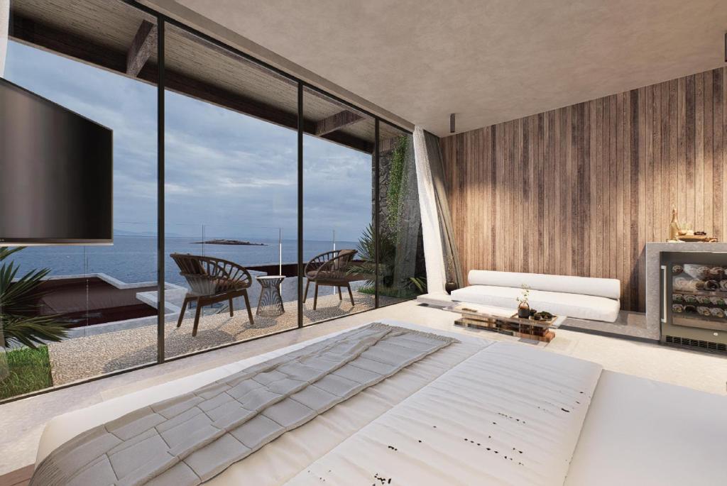 Ένα ή περισσότερα κρεβάτια σε δωμάτιο στο Voger Bodrum by The Sea