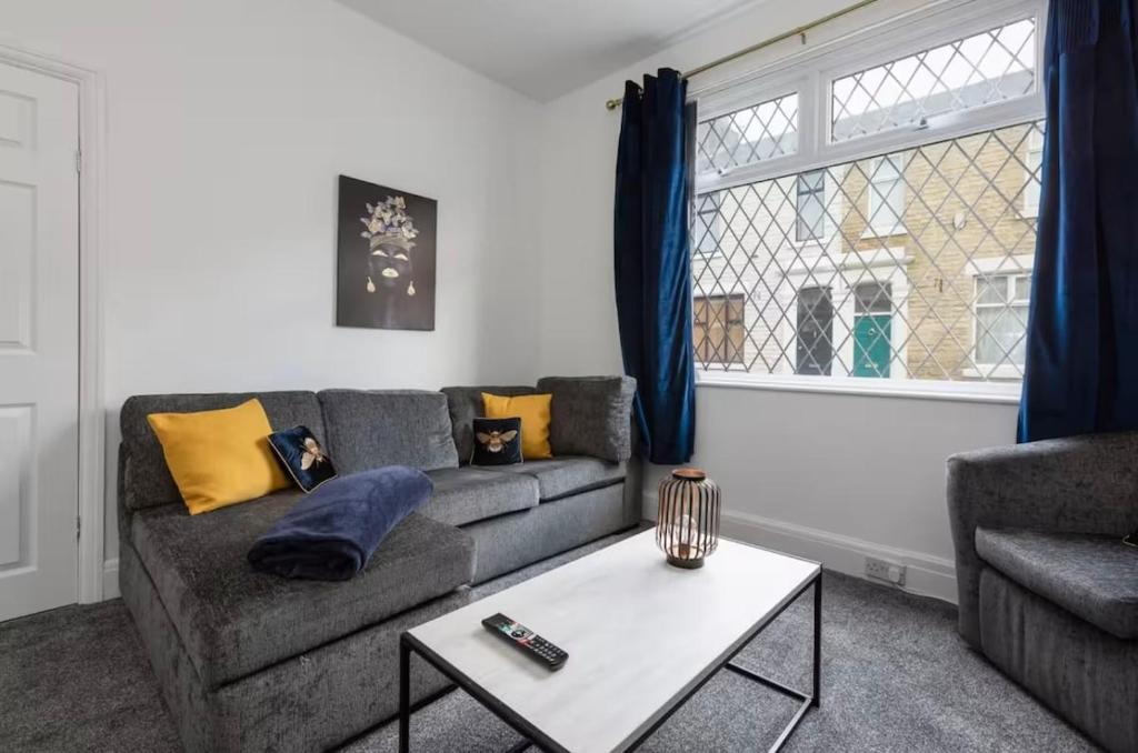 a living room with a couch and a table at Connaught Stays - Home from Home in Preston
