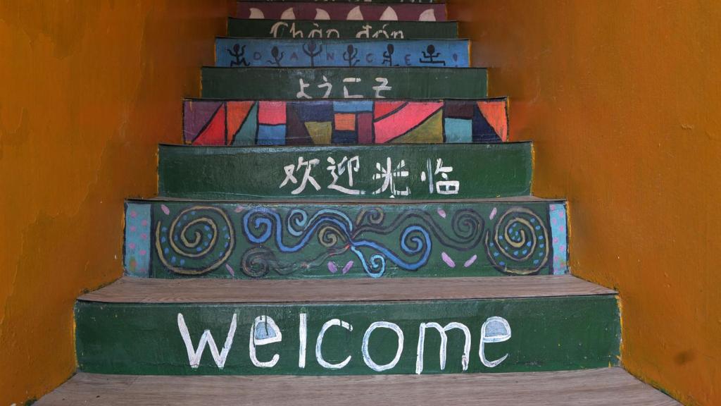 a set of stairs with welcome written on them at Ringo's Foyer in Malacca