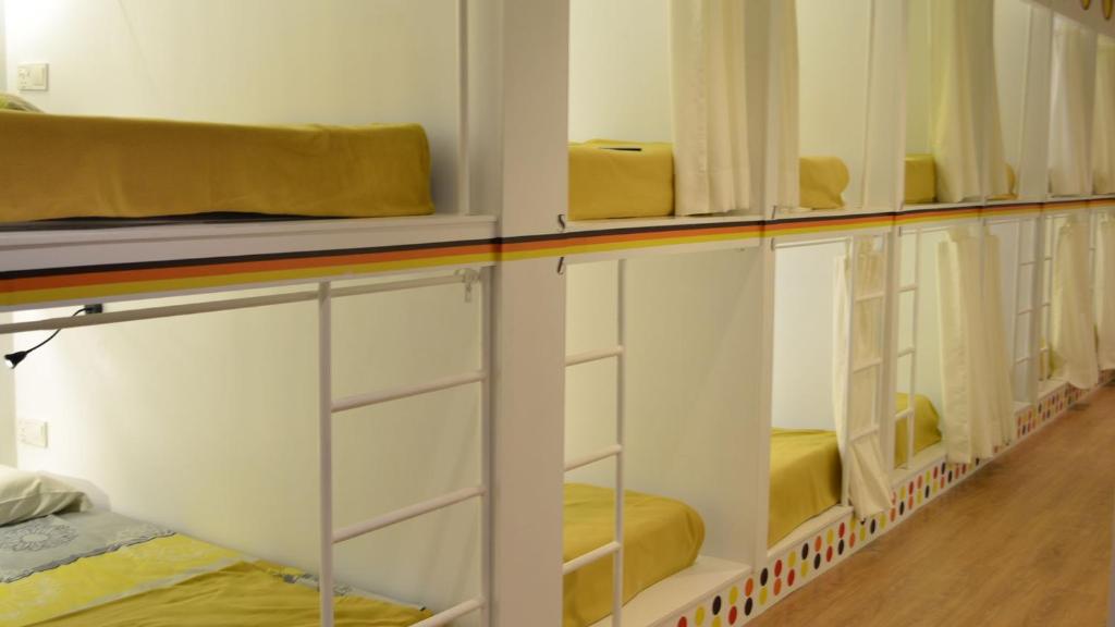 Postel nebo postele na pokoji v ubytování Ringo's Foyer