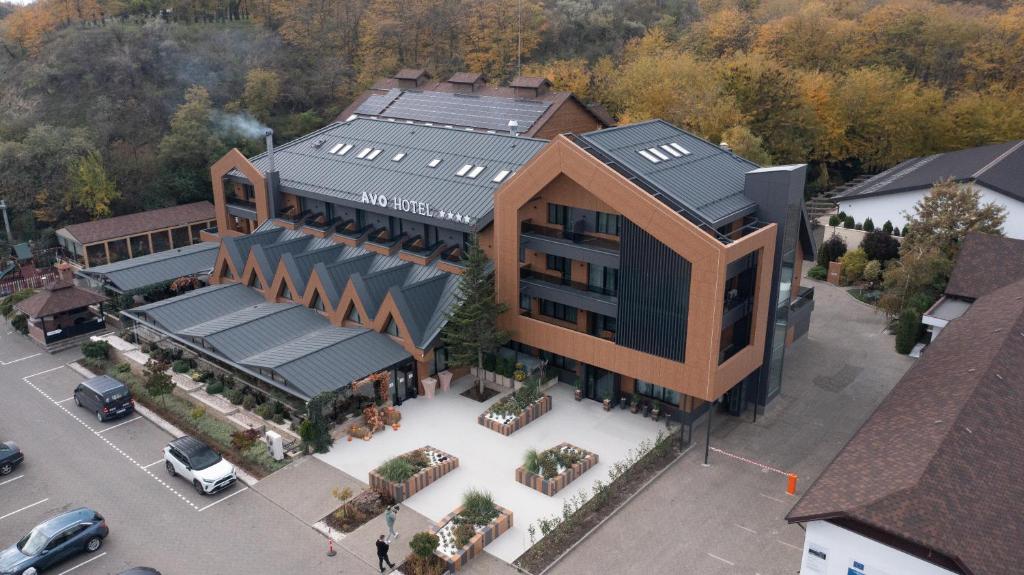an overhead view of a building in a parking lot at AVO Hotel in Rîmnicu Sărat