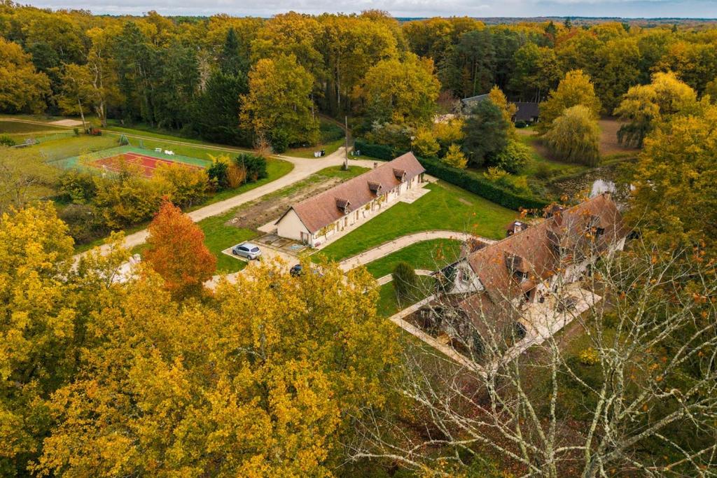 an aerial view of a house in the woods at Gîte du Dreuillet Charme & nature en Sologne in La Celle-sous-Gouzon