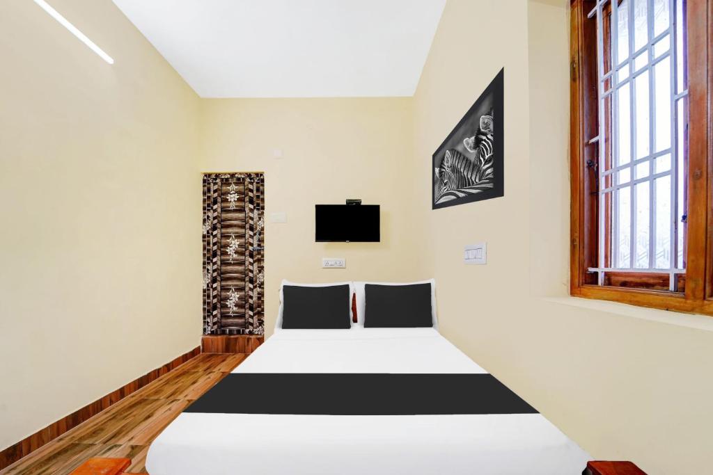 Afbeelding uit fotogalerij van Hotel O UDHAYA LODGE in Kuttālam