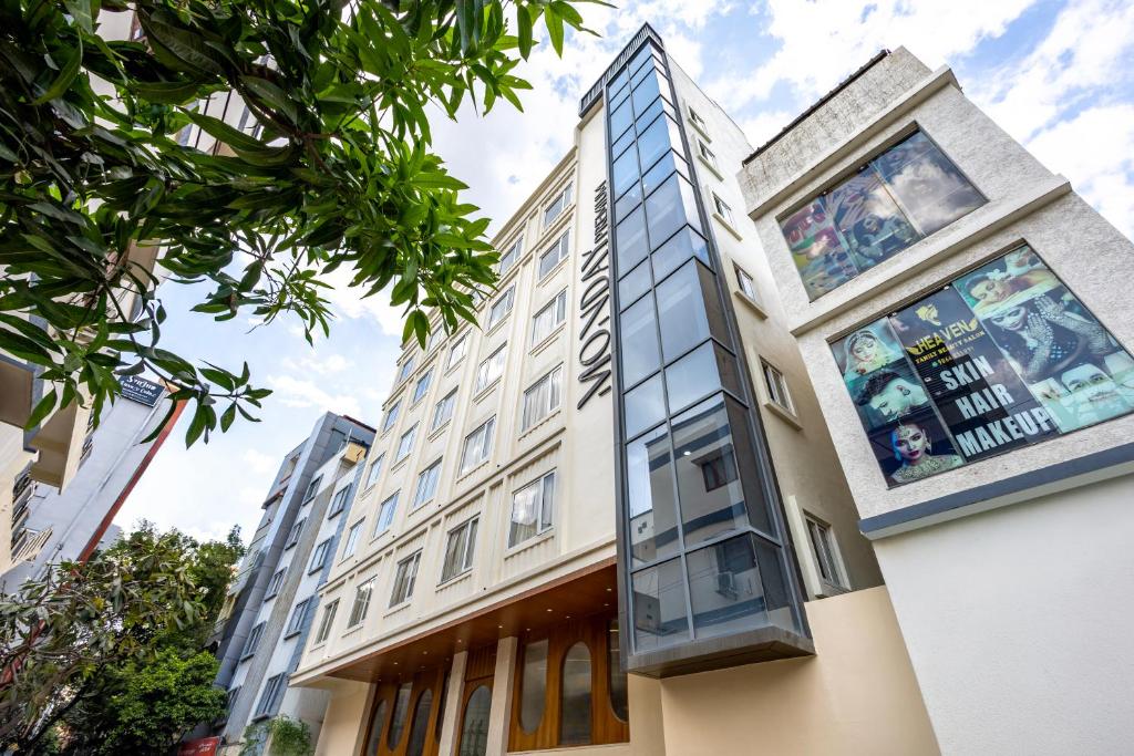 a building with glass windows on the side of it at Monday Premium Madhapur in Hyderabad