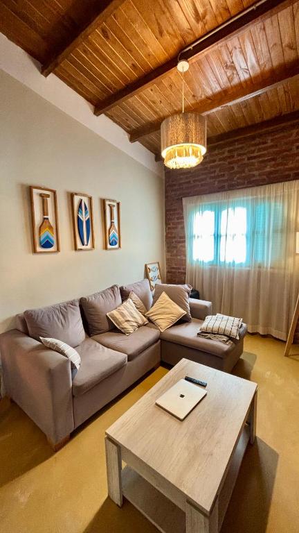 a living room with a couch and a table at Casa en el Quebrachito in Formosa
