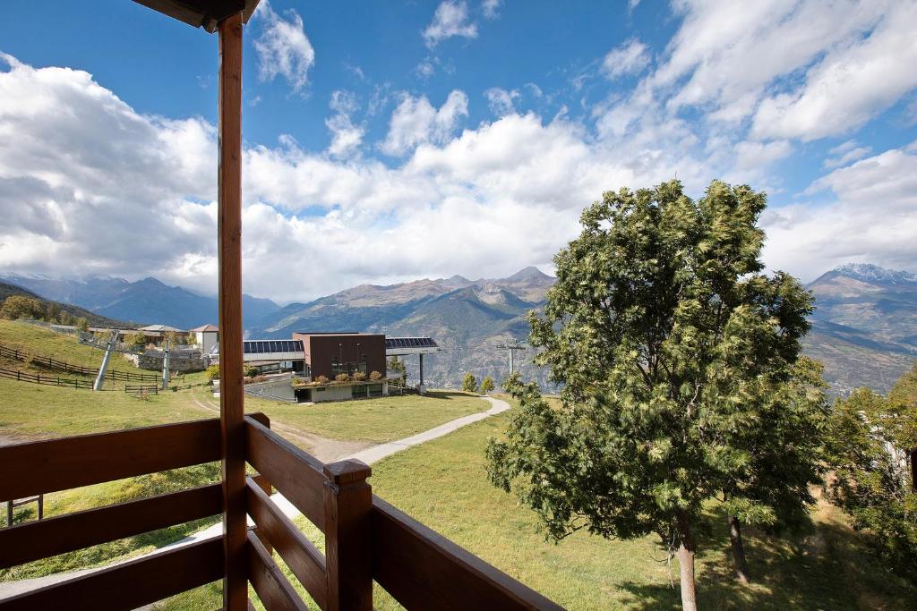 a view of the mountains from the porch of a house at Appartamenti Pila Vacanze 2 in Cerise