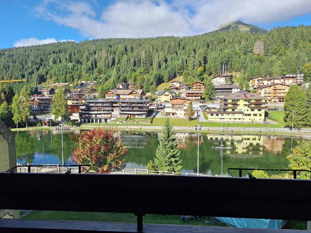 a view of a town with a lake and buildings at Casa Lolli in Madonna di Campiglio