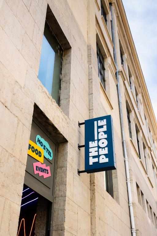 a store sign on the side of a building at The People Lyon in Lyon