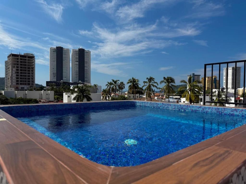 Πισίνα στο ή κοντά στο Depa A unas calles de la Playa y Zona Dorada ByGPS