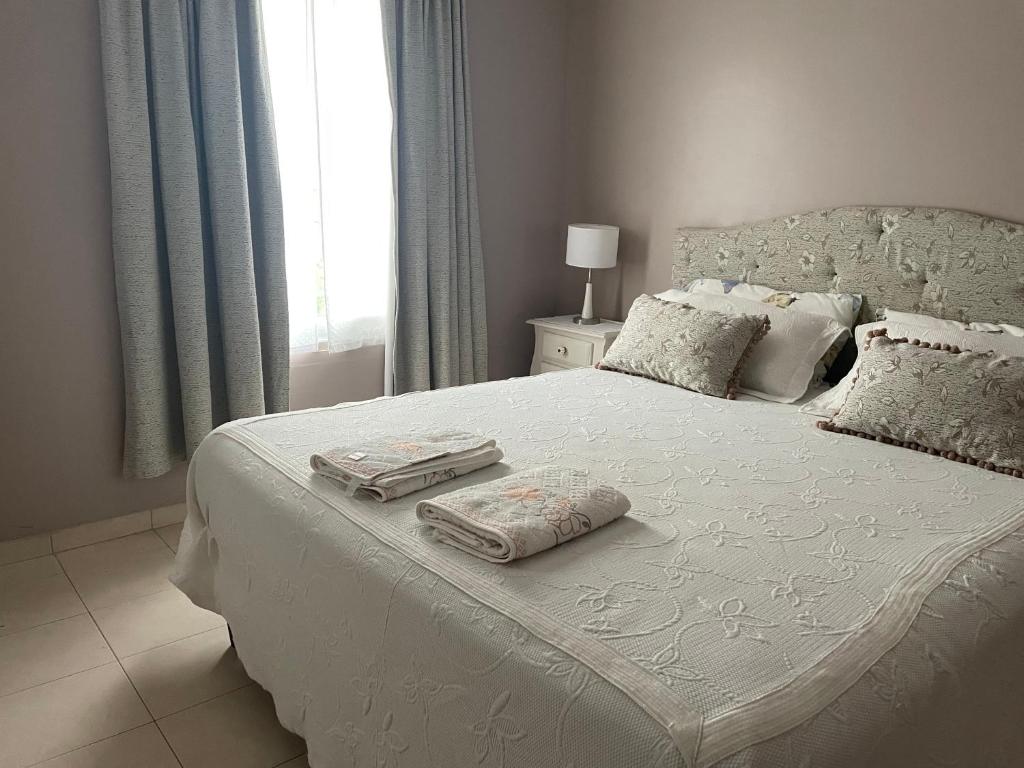 Giường trong phòng chung tại Cascada de Angeles