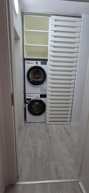 a laundry room with a washer and dryer at Szabo Georgiana in Alba Iulia