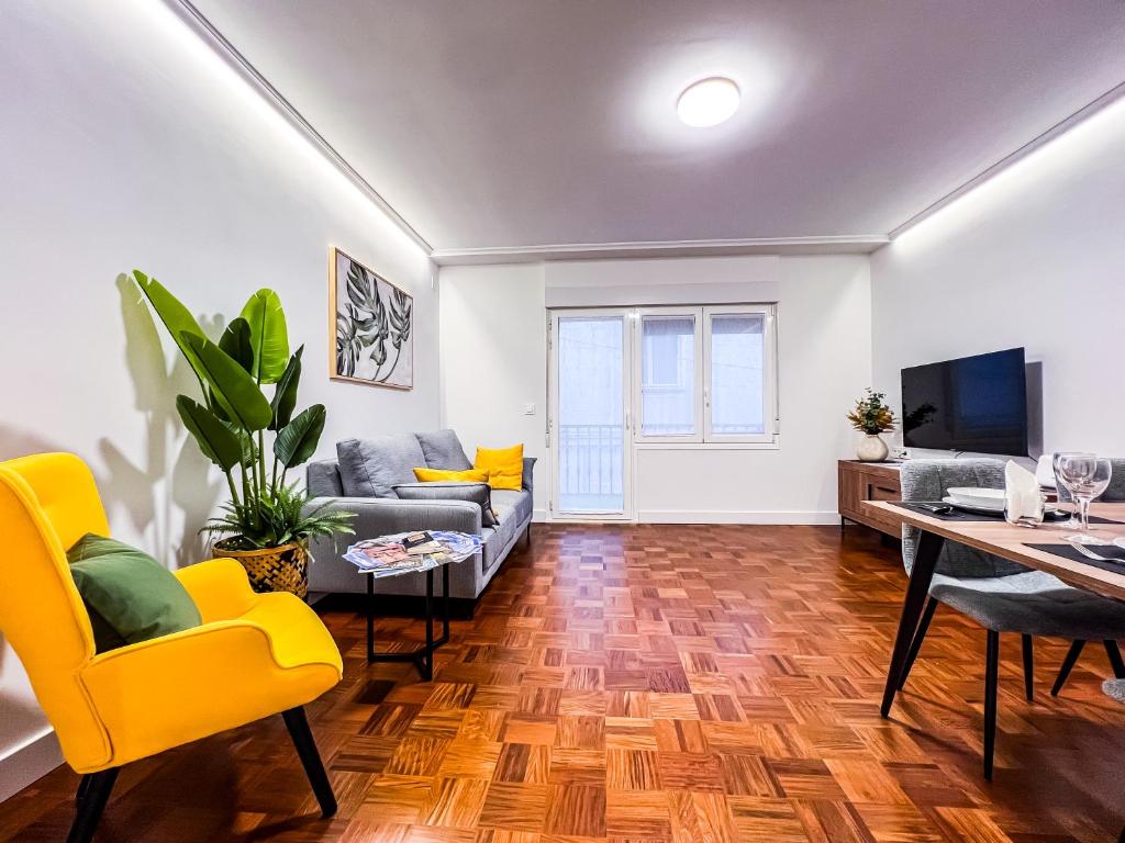 a living room with a couch and a table at El Balcón de Machado in Soria