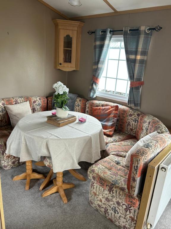 a living room with a couch and a table at My happy place in Greencastle