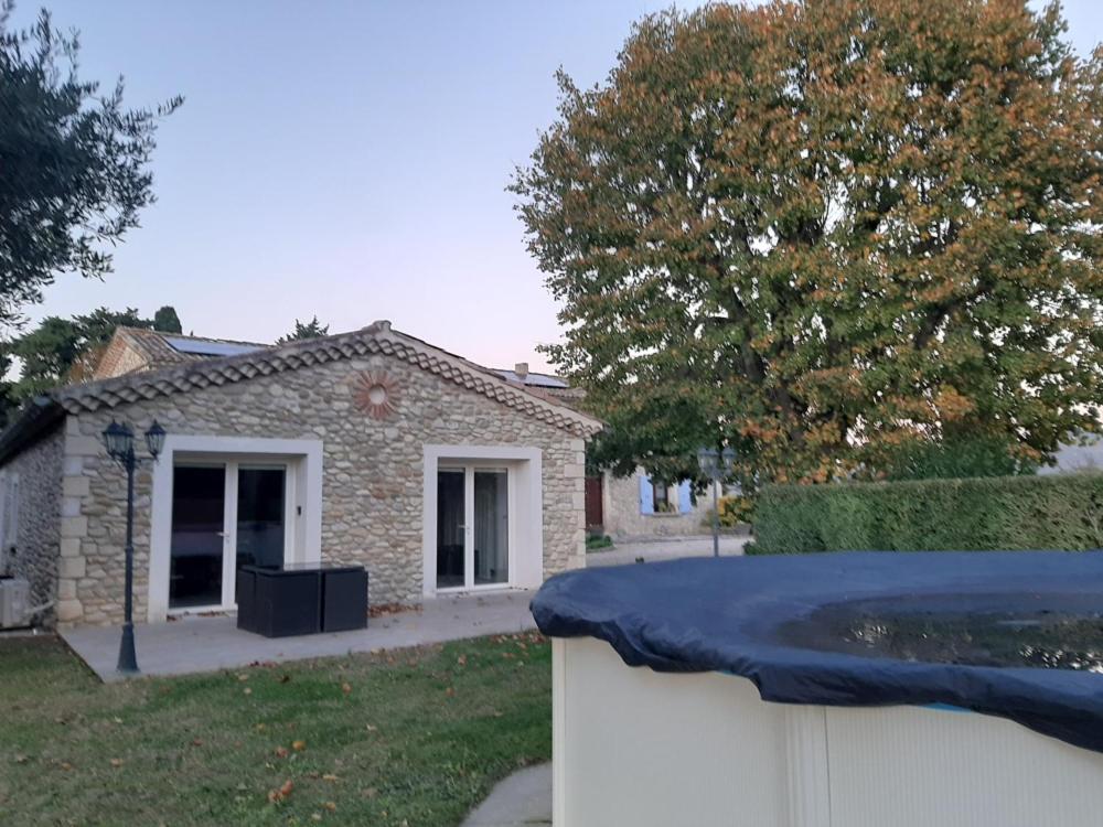 a house with a white fence in front of it at l esquisse in Cléon-dʼAndran