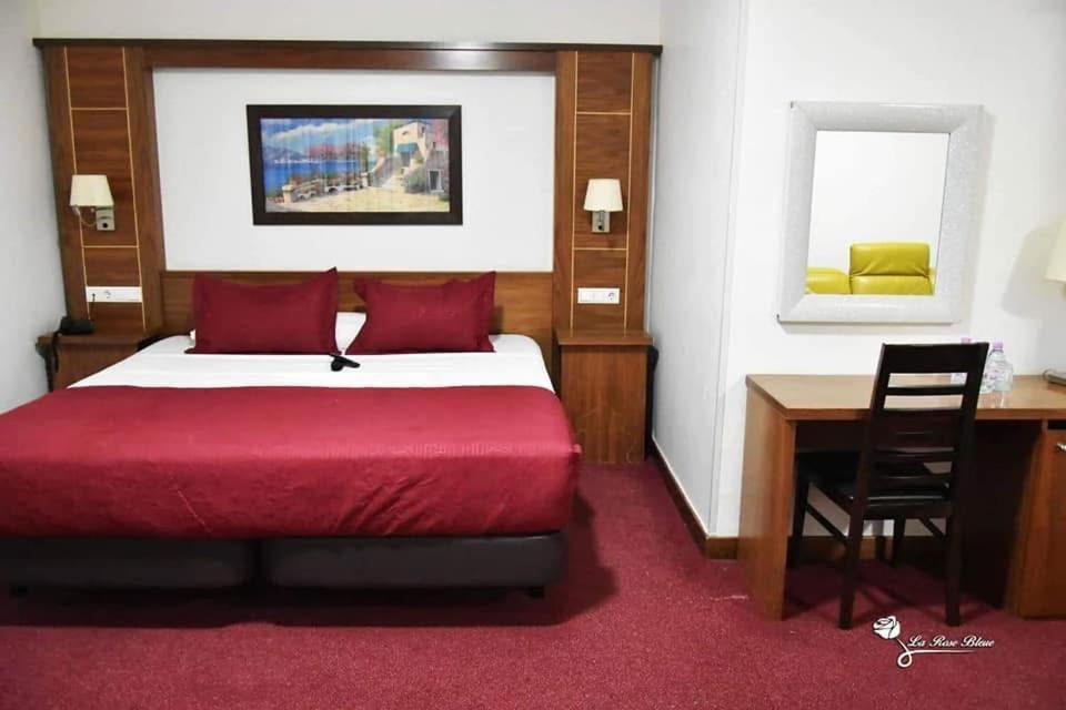 Ένα ή περισσότερα κρεβάτια σε δωμάτιο στο La Rose Bleue