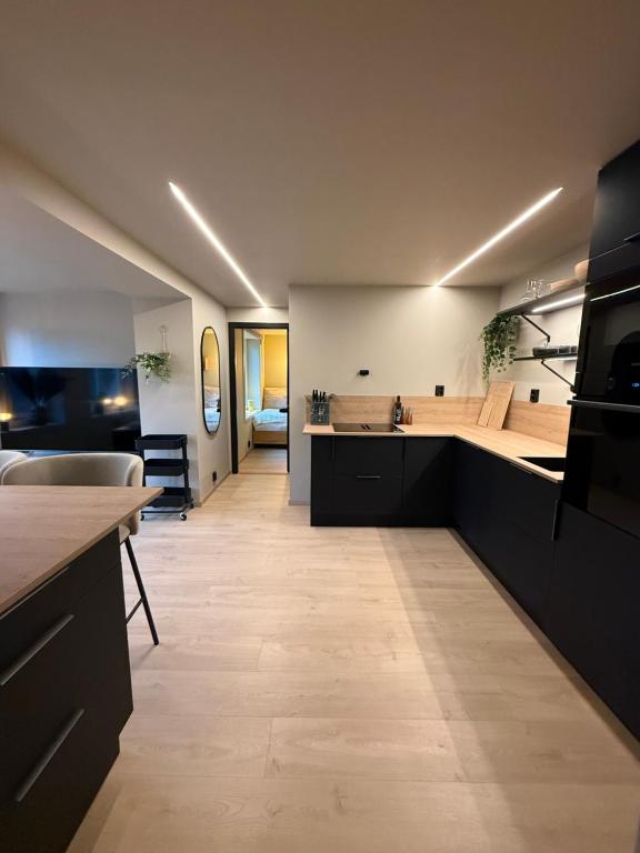 a kitchen with a sink and a counter top at Notodden Luxe Apartment in Notodden