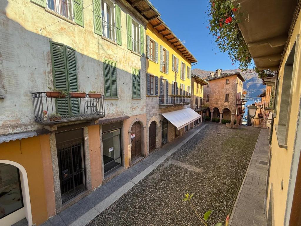 an empty street in an old town with buildings at Casa Iside in Cannobio