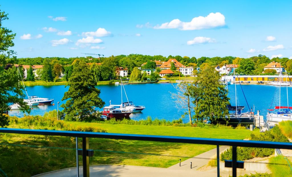 a view of a marina with boats in the water at Perfect View II - idealny widok na Marinę in Iława