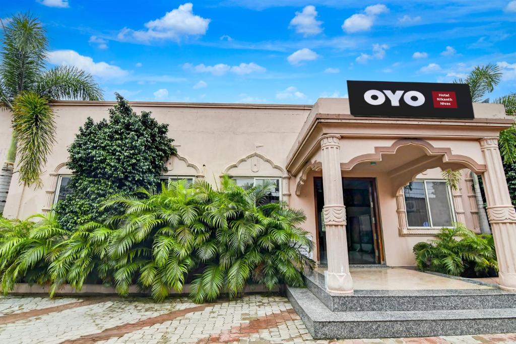 a building with an ovo sign on it at Hotel O Nilkanth Nivas in Puri