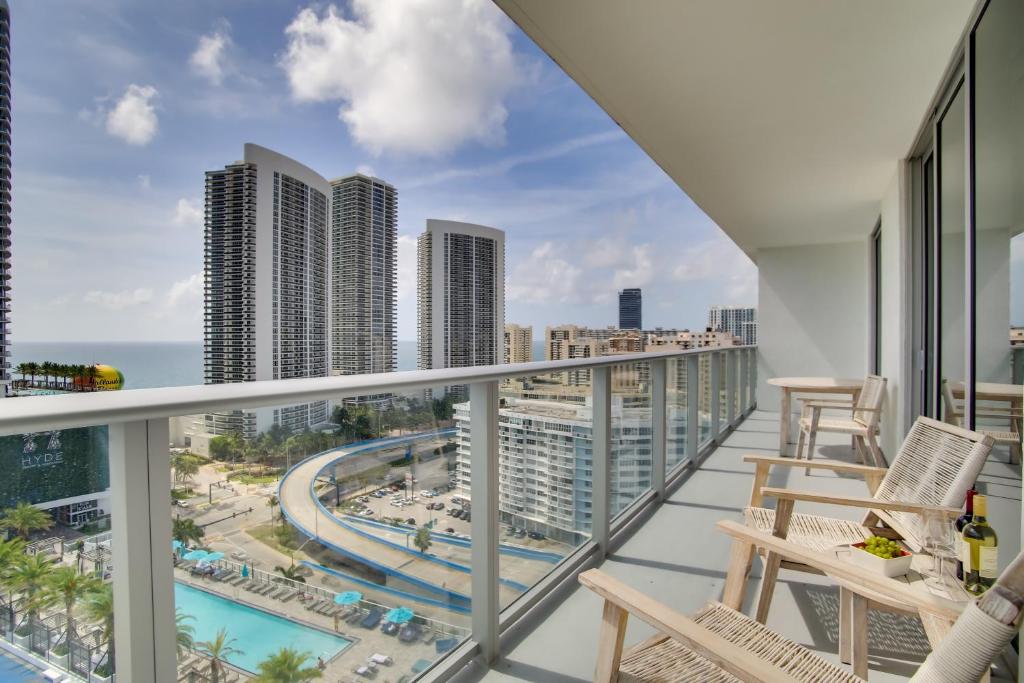 a balcony with chairs and a view of the city at Upscale Condo w/ Pool Access in Hyde Beach House! in Hollywood