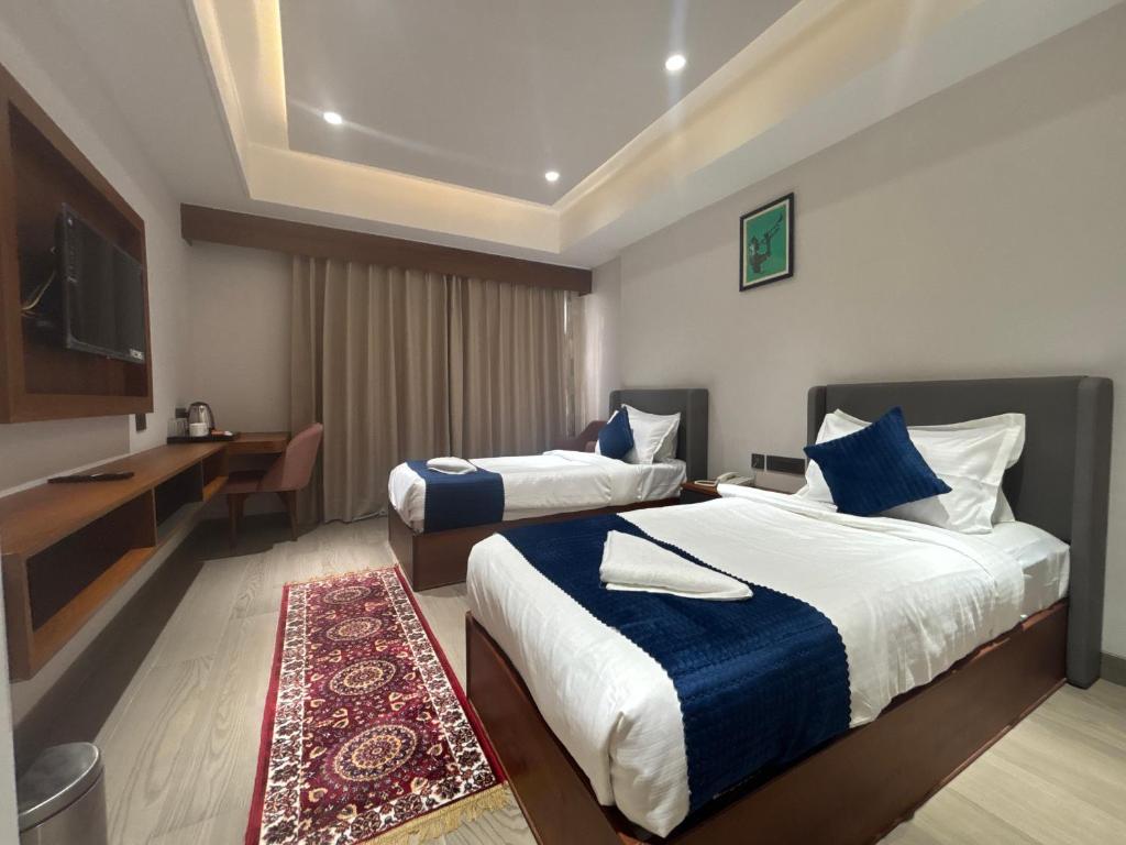 Postel nebo postele na pokoji v ubytování Hotel Amyra