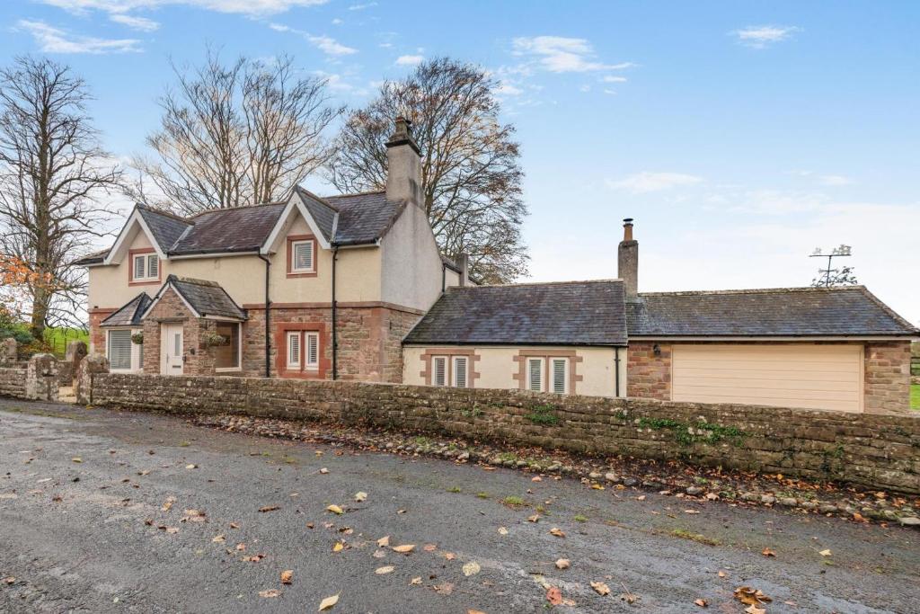 an old brick house with a stone wall at 3 Bed in Mealsgate oc-e33626 in Mealsgate