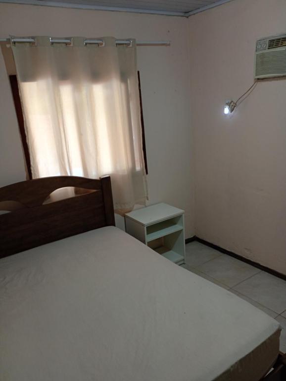 Postel nebo postele na pokoji v ubytování Casa em pantano grande