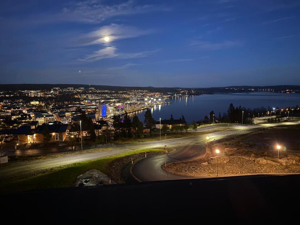 a view of a city at night with a river at Exklusivt boende i Örnsköldsvik in Örnsköldsvik