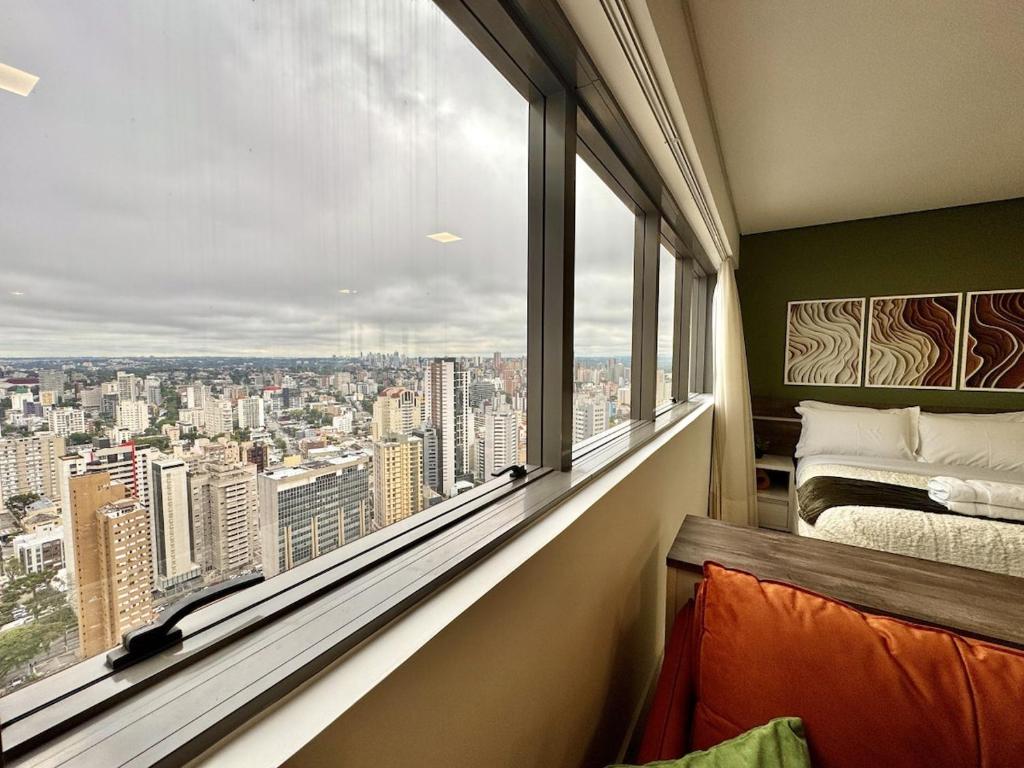 Ένα ή περισσότερα κρεβάτια σε δωμάτιο στο Vista Espetacular, Studio no Universe Life Square - by UROOMS