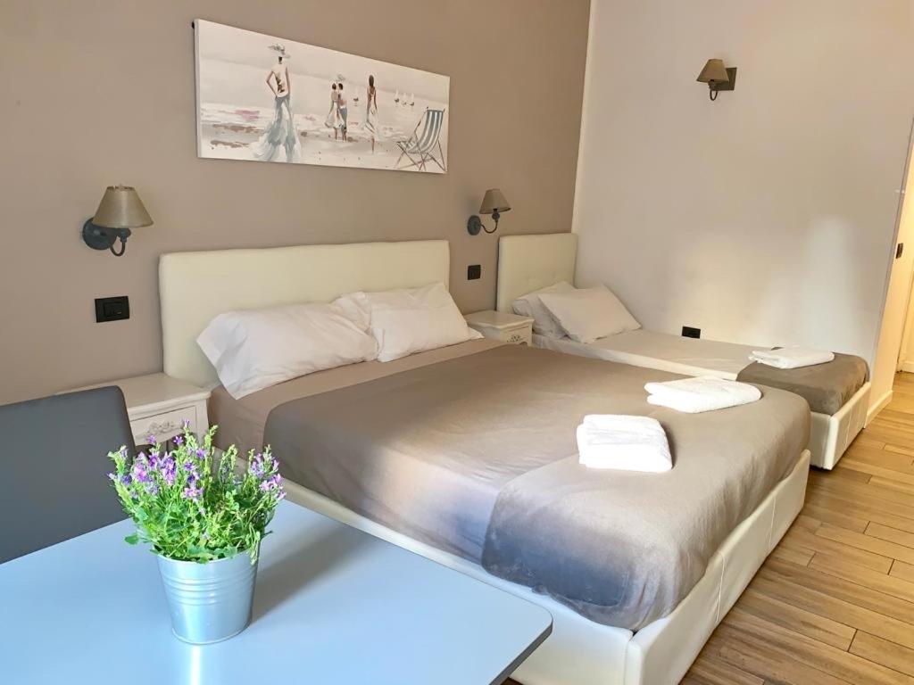 Postel nebo postele na pokoji v ubytování Rome Eternal City