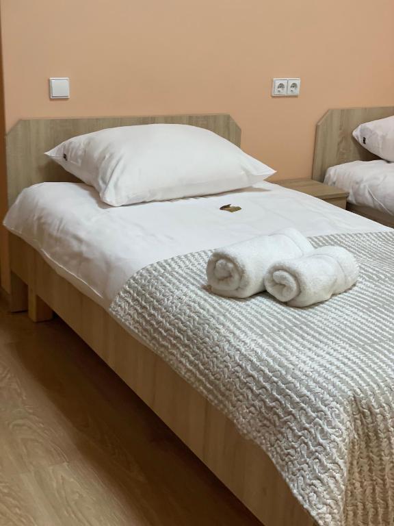 Postel nebo postele na pokoji v ubytování Apartamentai KAVA