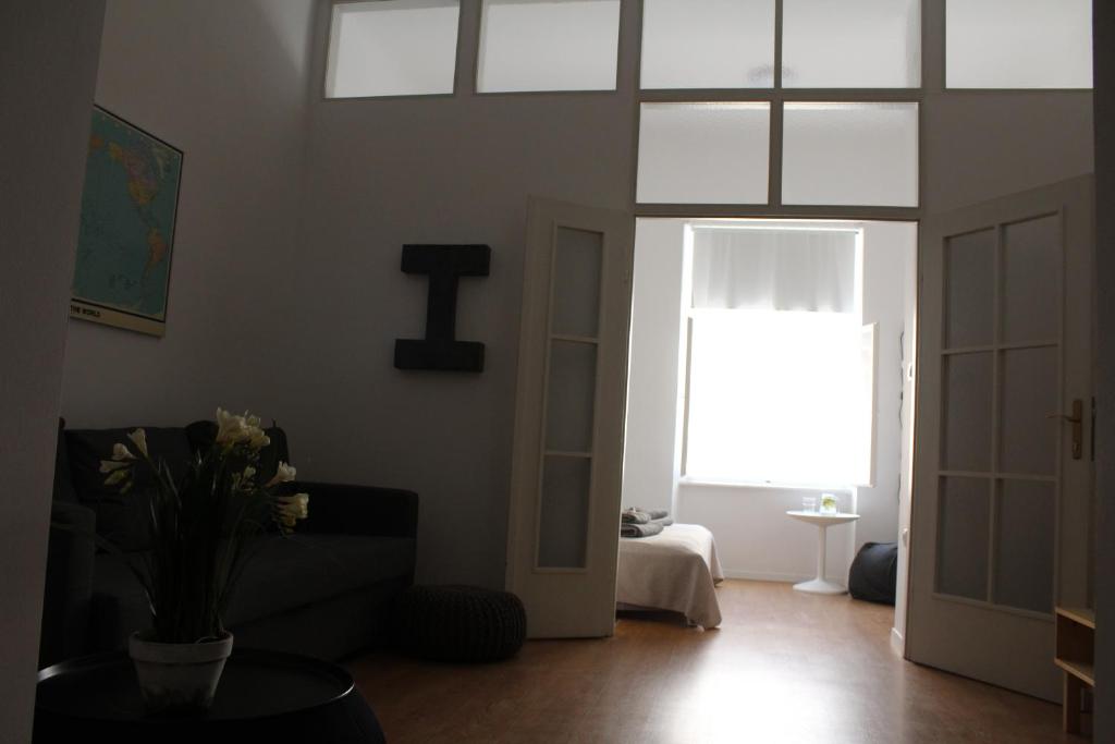 a living room with a couch and a window at Sasha Apartment in Zagreb