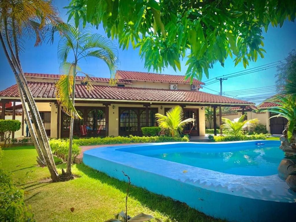 a house with a swimming pool in front of it at La Casa de Don Lucho - Santa Cruz in Santa Cruz de la Sierra