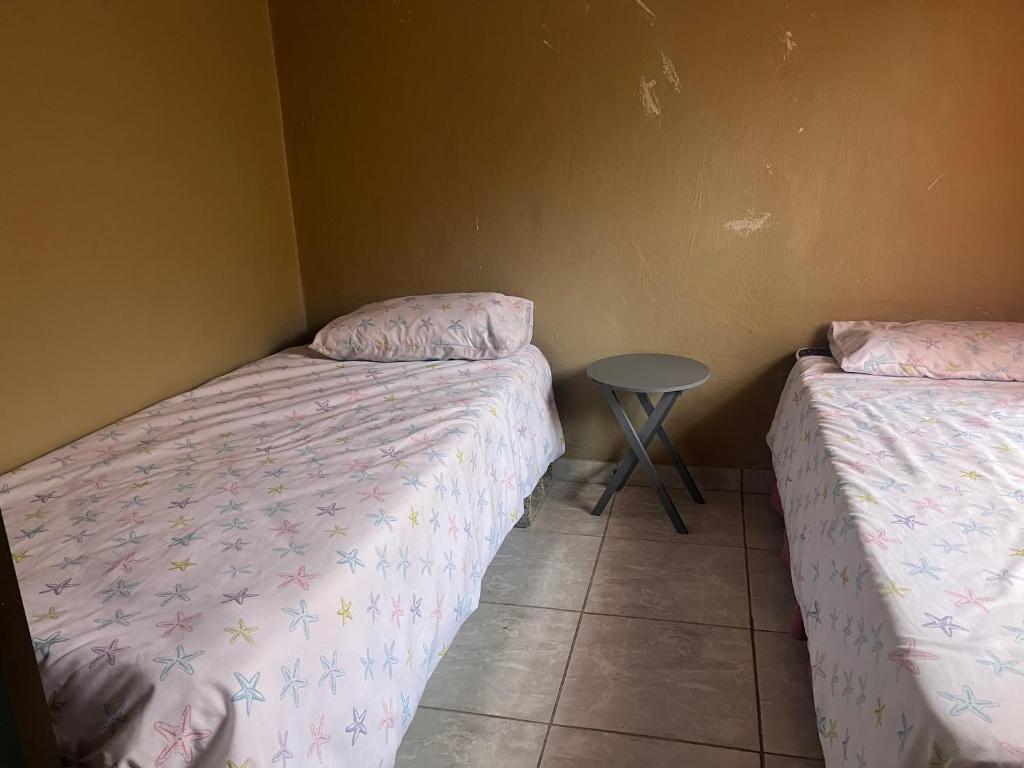 Ένα ή περισσότερα κρεβάτια σε δωμάτιο στο Lamont-Villa