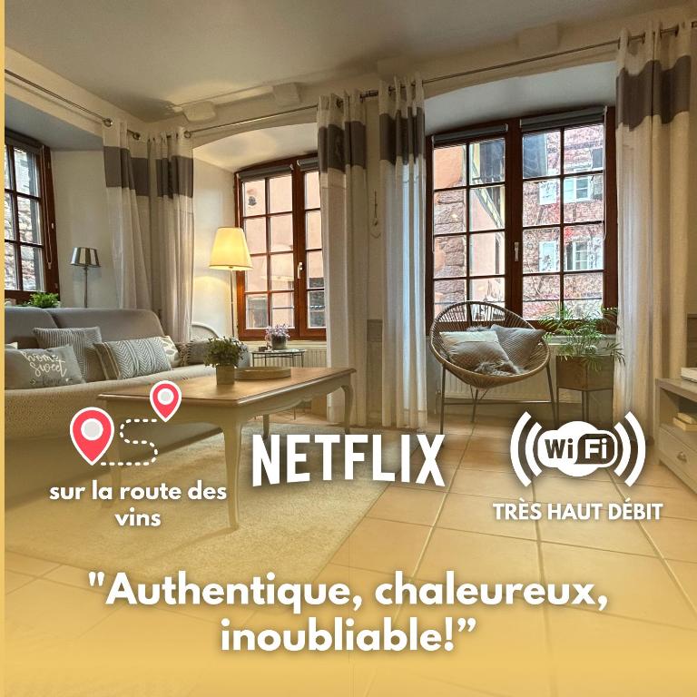 a living room with a couch and a table at le Roy de coeur in Riquewihr
