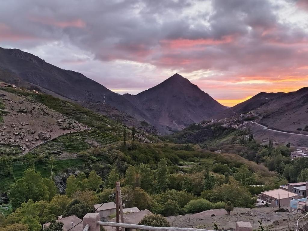 a view of a valley with mountains in the background at Dar Agourzi Café des Epices in Tacheddirt