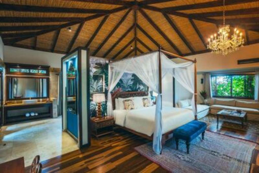 Ένα ή περισσότερα κρεβάτια σε δωμάτιο στο Nayara Springs - Adults Only