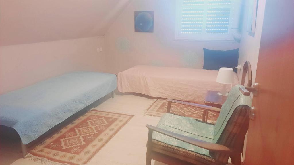 Postel nebo postele na pokoji v ubytování הבית של גלגל