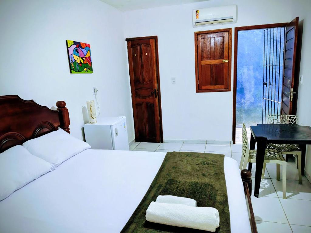 Postel nebo postele na pokoji v ubytování Quarto Feliz