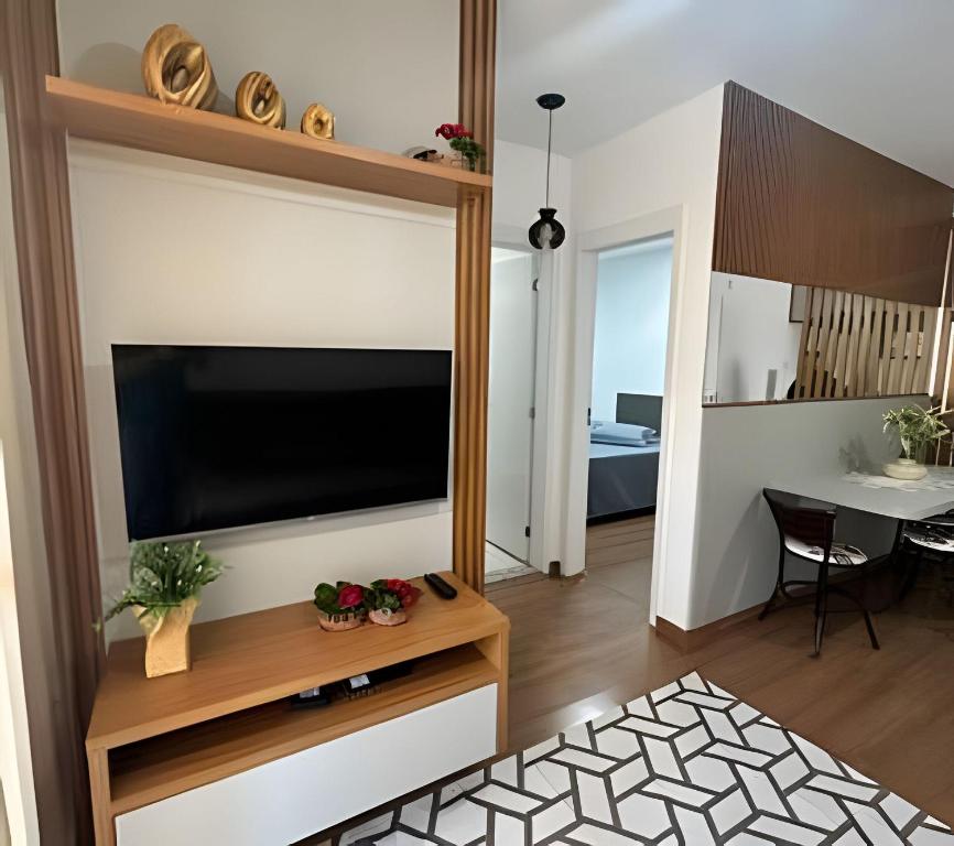 a living room with a flat screen tv on a wall at Rose Prime Loft in Extrema