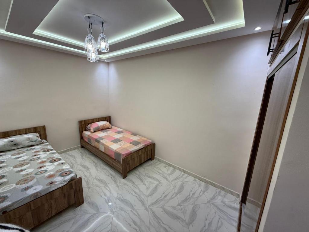 Postel nebo postele na pokoji v ubytování Downtown Fez Retreat