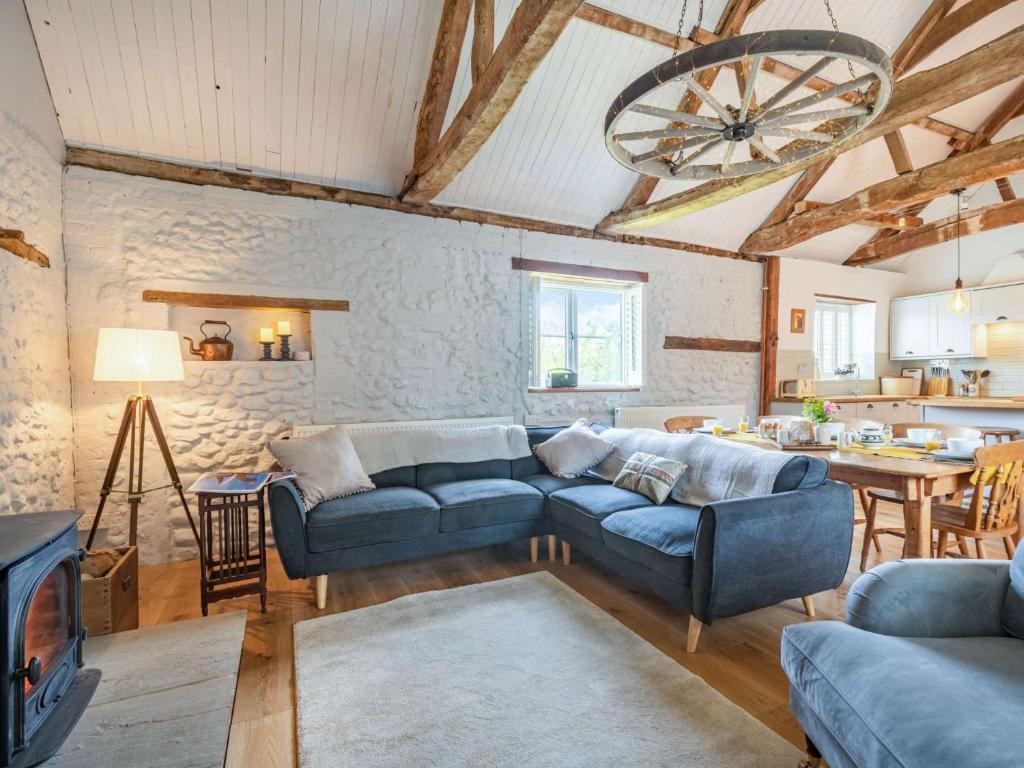 a living room with a blue couch and a table at 3 Bed in Beeston 88223 in Beeston