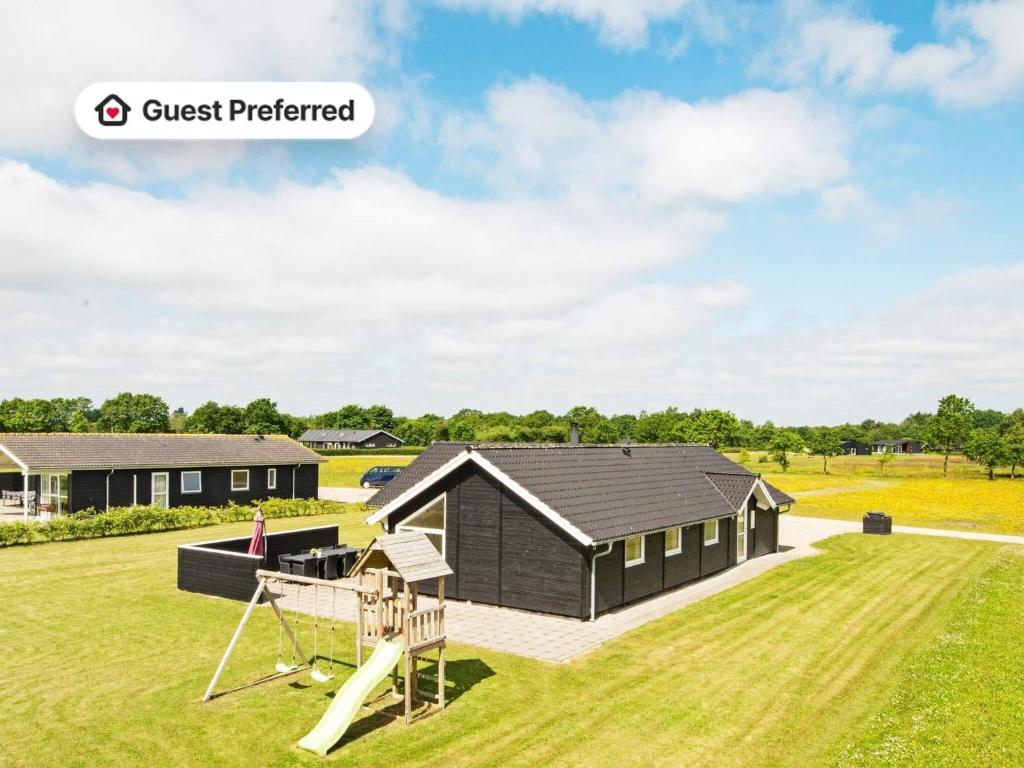 an image of a house with a playground at Luxury Lakeside Retreat - By Traum Ferienwohnungen in Ansager