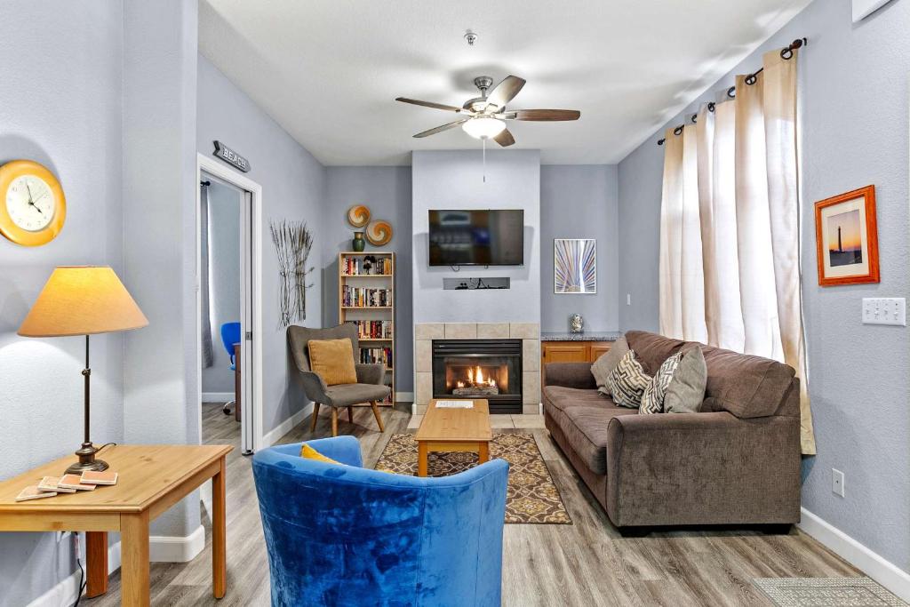 a living room with a couch and a fireplace at Peaceful Palace in Oceano