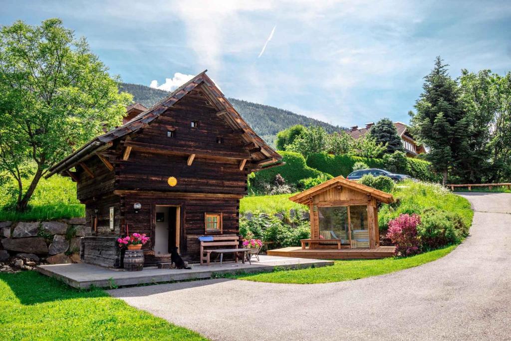 a small log cabin with a gazebo at Holiday Homes in Rennweg am Katschberg 47 in Aschbach