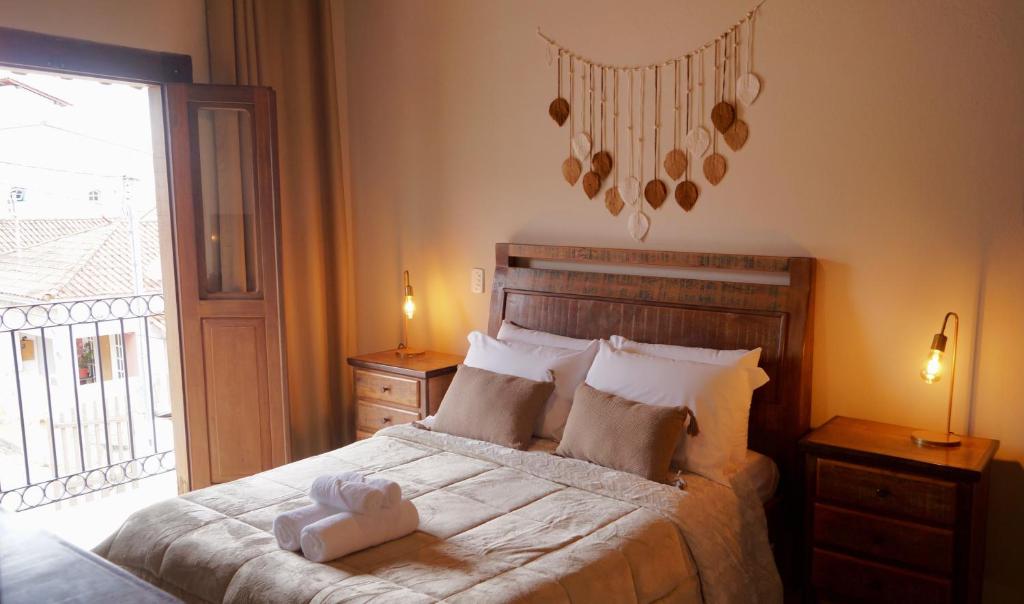 Ένα ή περισσότερα κρεβάτια σε δωμάτιο στο Recanto das Libélulas Pousada