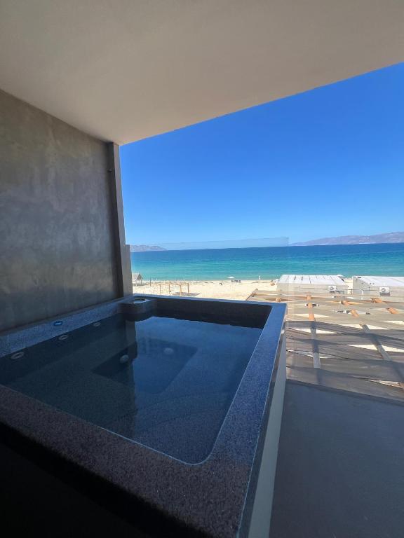 a view of the beach from a building with a swimming pool at Ocean View Luxury Condo Private Jacuzzi in La Ventana