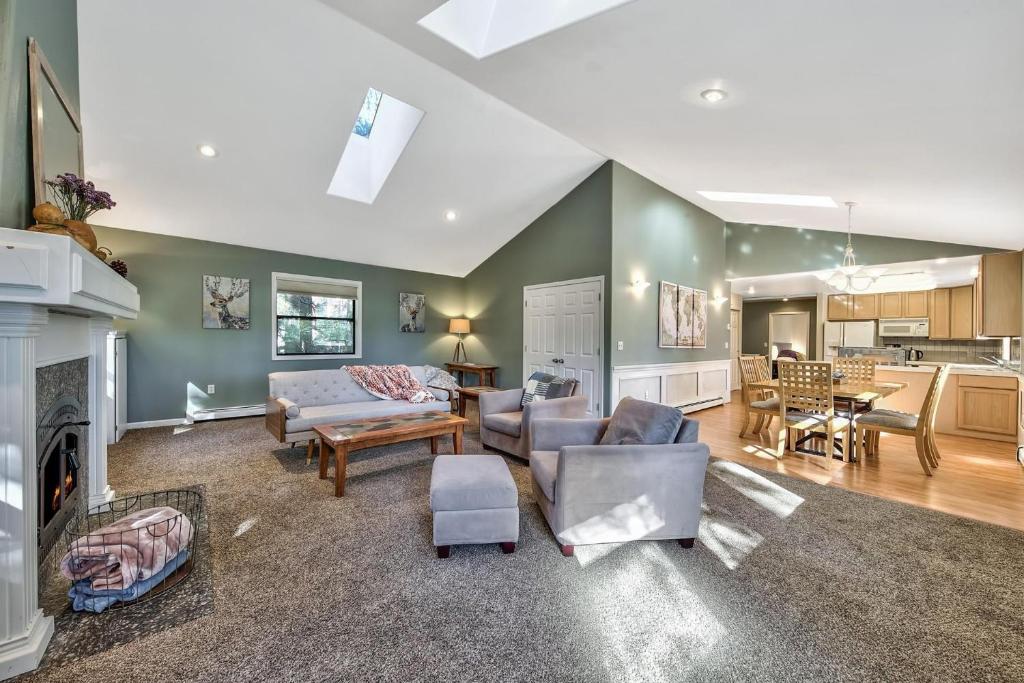 a living room with a couch and a fireplace at Minnow's Run in Brockway Vista