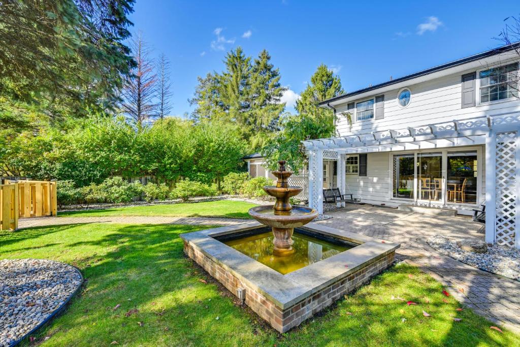 a yard with a fountain in front of a house at Private Pool and Home Theater Buchanan Family Home! in Buchanan